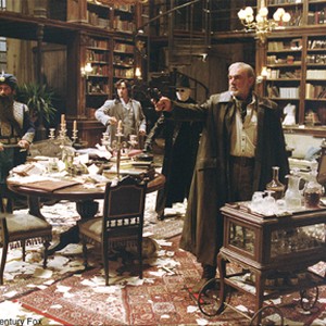 Allan Quatermain (Sean Connery) takes aim at attacking forces, as Captain Nemo (Naseeruddin Shah, left), Dorian Gray (Stuart Townsend) and an invisible man Rodney Skinner (Tony Curran) look on. photo 16