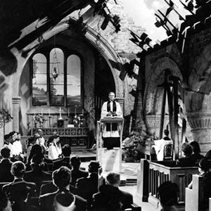 A scene still from the 1942 British wartime drama "Mrs. Miniver," featuring Henry Wilcoxon as the Vicar.