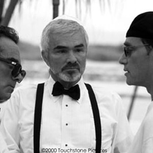 Stars Dan Hedaya (left) and Burt Reynolds (center) discuss a scene with director Michael Dinner. photo 16