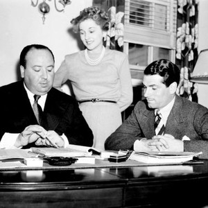 REBECCA, from left: director Alfred Hitchcock, Joan Fontaine, Laurence Olivier, on set, 1940