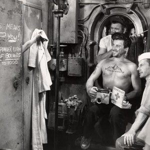 HELL AND HIGH WATER, Bella Darvi (left, in shower), Cameron Mitchell (front, second from right), Henry Kulky (back), David Wayne (right), 1954. TM and Copyright ©20th Century Fox Film Corp. All rights reserved..