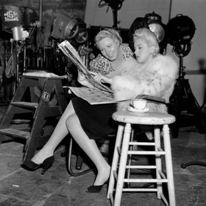 JOHNNY EAGER, from left, costars Connie Gilchrist, Lana Turner, relaxing on-set between scenes, November 1941