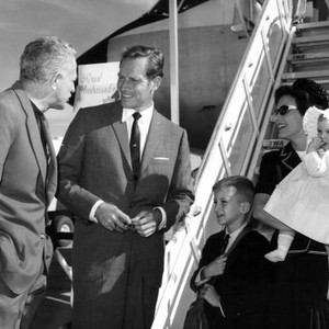 55 DAYS AT PEKING, Director Nicholas Ray meets arriving star Charlton Heston with family Fraser Heston, Lydia Heston, Holly Heston at the Madrid airport, 1962
