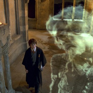 (L-r) Harry Potter (DANIEL RADCLIFFE) encounters Nearly Headless Nick (JOHN CLEESE) in Warner Bros. Pictures' "Harry Potter and the Chamber of Secrets."
