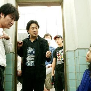 THIRST, (aka BAKJWI), foreground from left: SONG Kang-ho, director PARK Chan-wook, KIM Ok-vin, on set, 2009. ©Focus Features