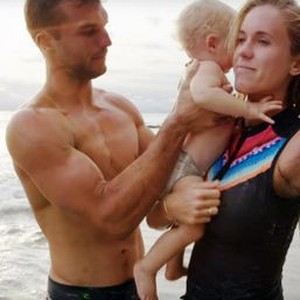 BETHANY HAMILTON: UNSTOPPABLE, ADAM DIRKS AND BETHANY HAMILTON WITH THEIR SON, TOBIAS DIRKS, 2018. © ENTERTAINMENT STUDIOS MOTION PICTURES