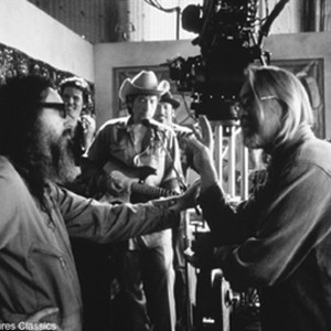 Filmmaker Larry Charles (left) directs a scene with Bob Dylan. photo 8