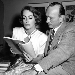 FLAMINGO ROAD, from left: Joan Crawford, director Michael Curtiz, reviewing script, 1949