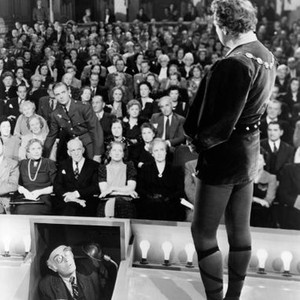 TO BE OR NOT TO BE, Jack Benny (on stage), Adolf E. Licho (in prompter box), Robert Stack (standing in audience), 1942, tobeornottobe1942m-fsct06, Photo by:  (tobeornottobe1942m-fsct06)