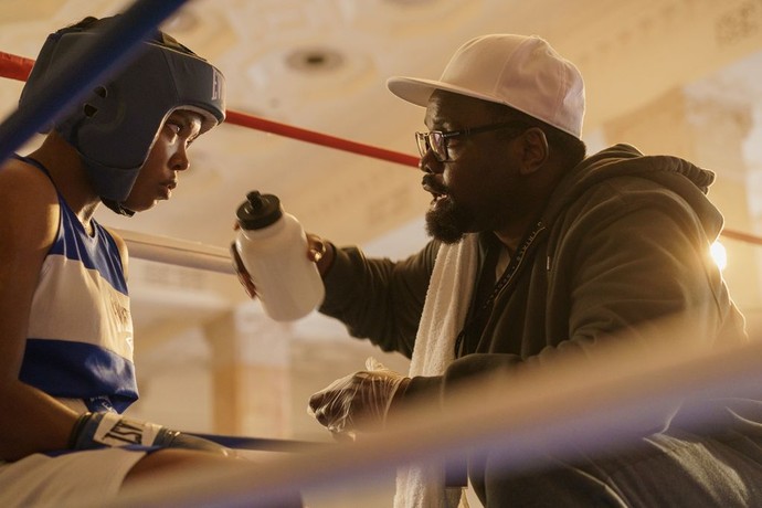 Claressa Shields (Ryan Destiny) and coach Jason Crutchfield (Brian Tyree Henry) talk strategy between rounds, in "The Fire Inside." (Amazon MGM Studios)