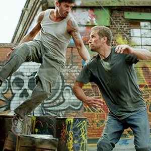(L-R) David Belle as Lino and Paul Walker as Damien in "Brick Mansions." photo 1