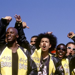 Kid (DEREK LUKE, front left) and Primo (RICK GONZALEZ, front right) and the rest of the Biker Boyz cheer on another racer in DreamWorks Pictures' actioner BIKER BOYZ. photo 13