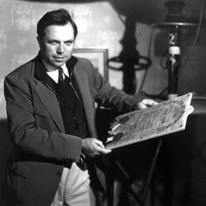 STELLA DALLAS, director King Vidor with a certificate of appreciation given to him on set, 1937