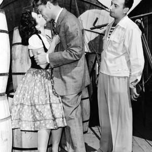 WHISTLING IN BROOKLYN, director S. Sylvan Simon (right) directing Ann Rutherford and Red Skelton, on set, 1943