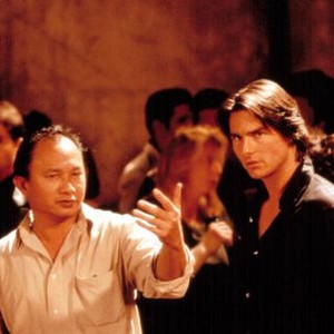 MISSION: IMPOSSIBLE II, Director John Woo, Tom Cruise on the set, 2000. (c) Paramount Pictures.