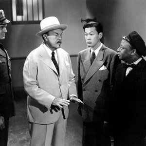 DARK ALIBI, Sidney Toler (second from left), Benson Fong, Mantan Moreland, 1946