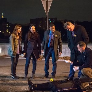 Elementary, from left: Ophelia Lovibond, Lucy Liu, Jon Michael Hill, Aidan Quinn, Jonny Lee Miller, 'End of Watch', Season 3, Ep. #8, 12/18/2014, ©KSITE