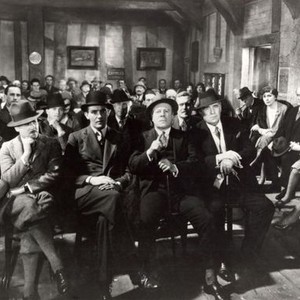 THE SKIN GAME, front row: Edward Chapman (second from left, moustache), John Longden, Edmund Gwenn (bidding); seated at right: Helen Haye (third from right), C.V. France, Jill Esmond, 1931