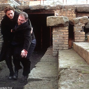 Alex (Heath Ledger) helps an injured Thomas (Mark Addy) following their first encounter with The Order. photo 3