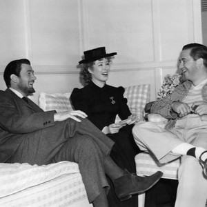 MADAME CURIE, Walter Pidgeon, Greer Garson, director Mervyn LeRoy, relax between takes, 1943