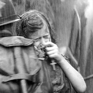 A terrified little girl seeks the protection of an American soldier. photo 17