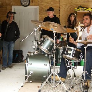 DEMOLITION, director Jean-Marc Vallee (left), Jake Gyllenhaal (at drums), on set, 2015. ph: Anne Marie Fox/TM & ©Copyright Fox Searchlight. All rights reserved.
