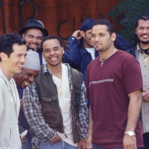 JOHN LEGUIZAMO (left) and VINCENT LARESCA (second from right) take five with friends on the set of Empire. photo 1