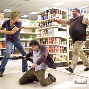 (Left) Woody Harrelson as Tallahassee and Jesse Eisenberg (center) as Columbus in "Zombieland." photo 7