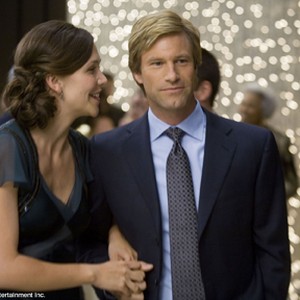 MAGGIE GYLLENHAAL stars as Rachel Dawes and AARON ECKHART stars as Harvey Dent in Warner Bros. Pictures' and Legendary Pictures' action drama "The Dark Knight." photo 11