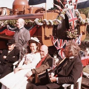 THE RAILWAY CHILDREN, Bernard Cribbins (seated left), Jenny Agutter sitting on lap of director Lionel Jeffries on set, 1970, trc1970yu-fsct10, Photo by:  (trc1970yu-fsct10)