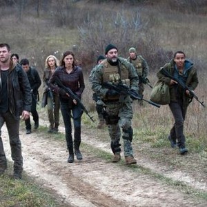 RED DAWN, Chris Hemsworth (left), Isabel Lucas (blonde hair, back), Adrianne Palicki (woman in front), Jeffrey Dean Morgan (front, stocking cap), Connor Cruise (right), 2012. ph: Ron Phillips/©Open Road Films