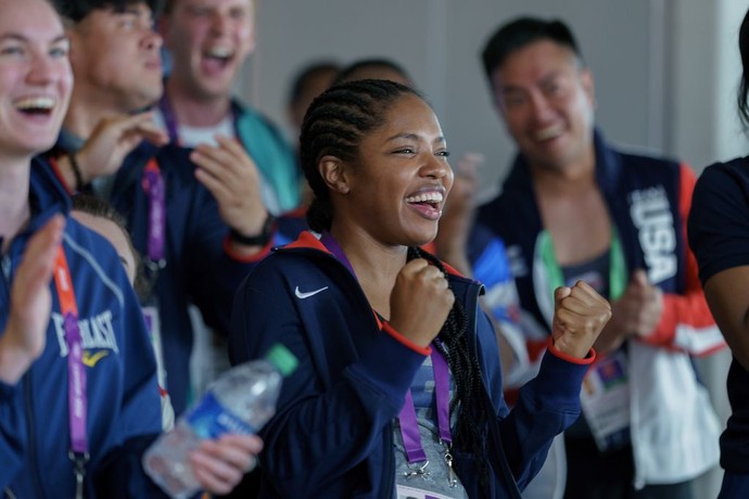 Claressa Shields (Ryan Destiny, center) and fellow Olympic athletes cheer American swimmer Michael Phelps at the 2012 Olympics, in "The Fire Inside." (Amazon MGM Studios)