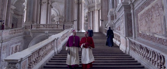 Monsignor O'Malley (Brian F. O’Byrne, L) and Cardinal Lawrence (Ralph Fiennes) confer, in "Conclave." (Focus Features) <span style="color: #ff0000;"> <br/></span>