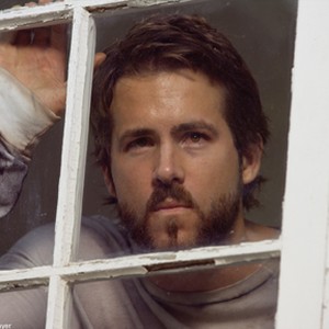 RYAN REYNOLDS stars as George Lutz in MGM Pictures' horror THE AMITYVILLE HORROR. photo 18