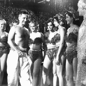 SPLENDOR IN THE GRASS, barechested Director, Elia Kazan, with Phyllis Diller and showgirls, 1961.