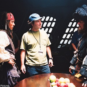 Johnny Depp, Director of Photography Danusz Wolski, and Geoffrey Rush on the set during the filming of Walt Disney Pictures' "Pirates of the Caribbean: The Curse of the Black Pearl."