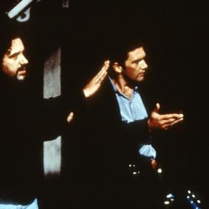 TWO MUCH, from left: director Fernando Trueba, Antonio Banderas on set, 1995, © Buena Vista