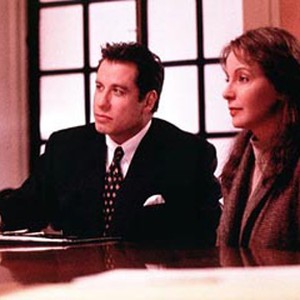 John Travolta (left) stars as attorney Jan Schlichtmann, and Kathleen Quinlan (right) stars as Anne Anderson. photo 13
