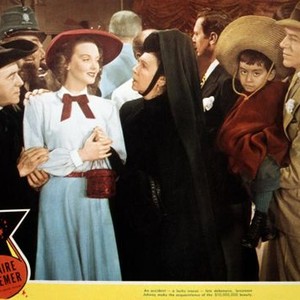 YOLANDA AND THE THIEF, from left: Francis Pierlot, Lucille Bremer, Mary Nash (hand on shoulder), Fred Astaire (holding child), 1945