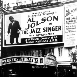 THE JAZZ SINGER, Al Jolson on billboard outside the Warners Theatre in New York during the film's premiere run, 1927