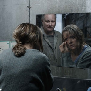 (L-R) In the mirror Stellan Skarsgard as Ulrik and Jarunn Kjellsby as Karen Margrethe in "A Somewhat Gentle Man." photo 17