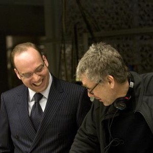 DUPLICITY, from left: Paul Giamatti, director Tony Gilroy, on set, 2009. ©Universal
