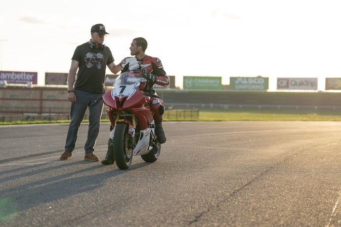 Dean (Eric Dane, L) gives Wes (K. J. Apa) some racing advice, in "One Fast Move." (Amazon Prime Video)