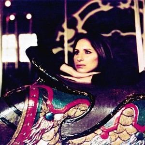 UP THE SANDBOX, Barbra Streisand, 1972. Riding on the Central Park carousel, in NYC.