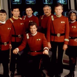 STAR TREK V: THE FINAL FRONTIER, (l-r standing): Leonard Nimoy, George Takei, James Doohan, DeForest Kelley, Nichelle Nichols, (seated front): William Shatner, 1989, (c)Paramount
