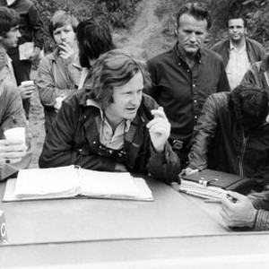 DELIVERANCE, from left: Jon Voight, producer-director John Boorman, Burt Reynolds, on set, 1972