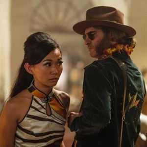 INHERENT VICE, from left: Hong Chau, Joaquin Phoenix, 2014. ph: Wilson Webb/©Warner Bros.