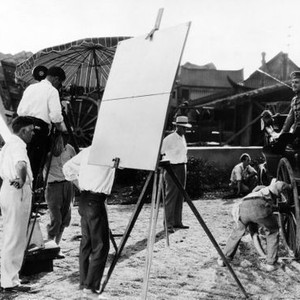 FLESH AND THE DEVIL, director Clarence Brown, (left), John Gilbert, (in carriage), on-set, 1926