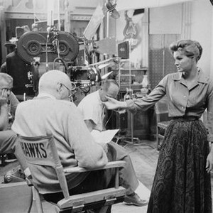RIO BRAVO, foreground from left: director Howard Hawks, Angie Dickinson, on set, 1959