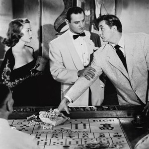 MACAO, from left: Gloria Grahame, Brad Dexter, Robert Mitchum, 1952